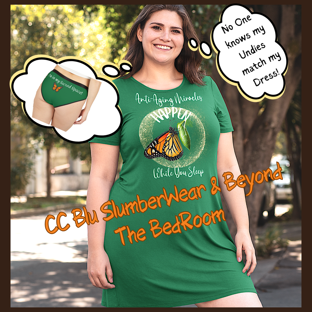 A woman wearing a green t-Dress with a Monarch butterfly on her heart